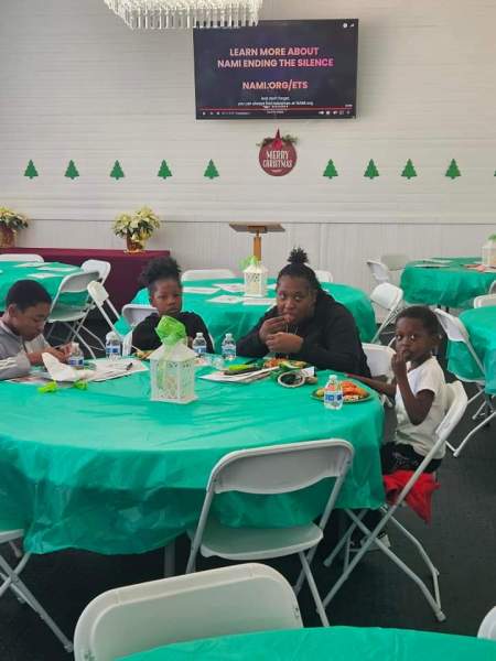 Families gathered at a community mental wellness event